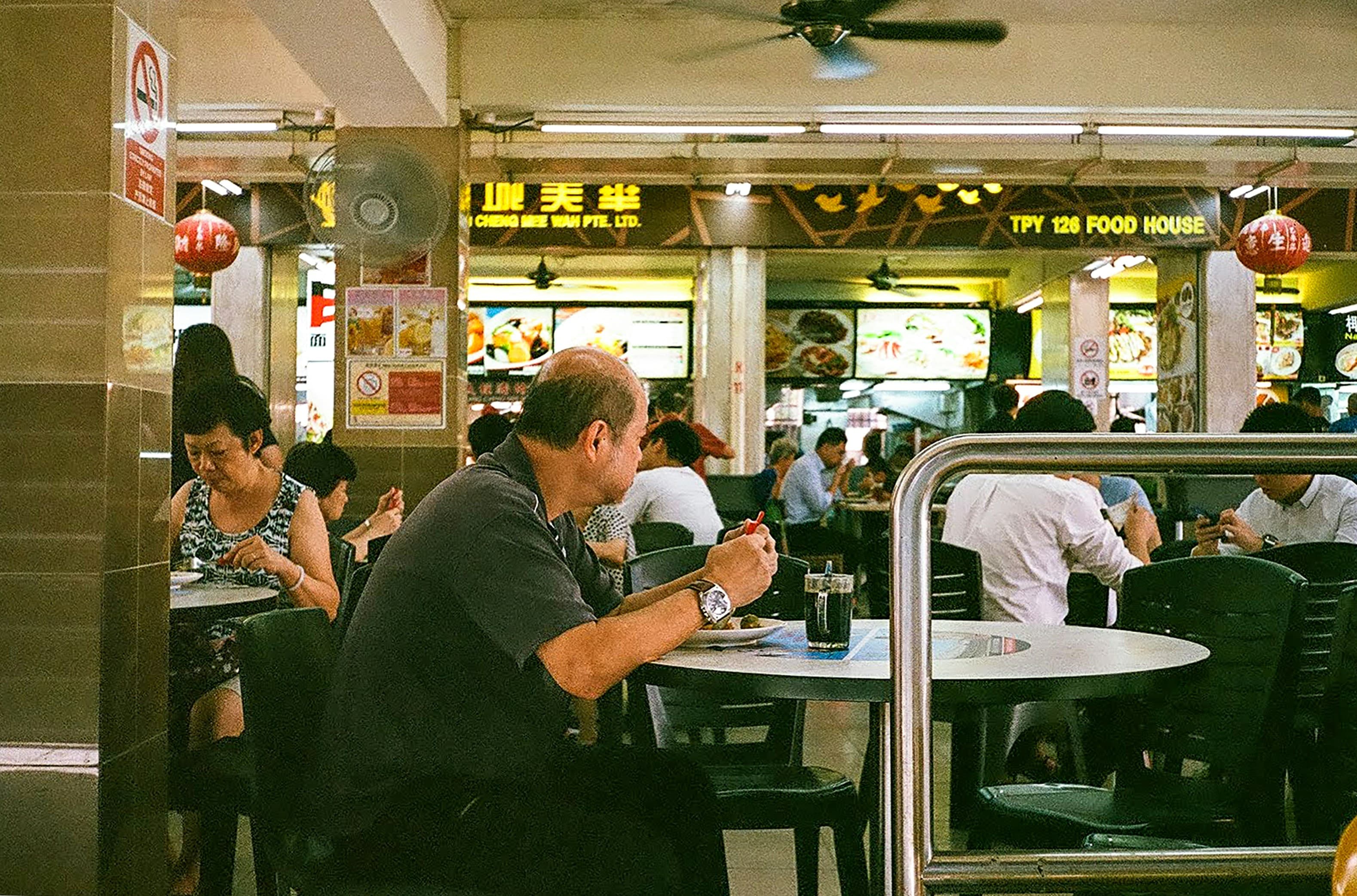 Happy customers enjoying food at Thomas's Hamburgers